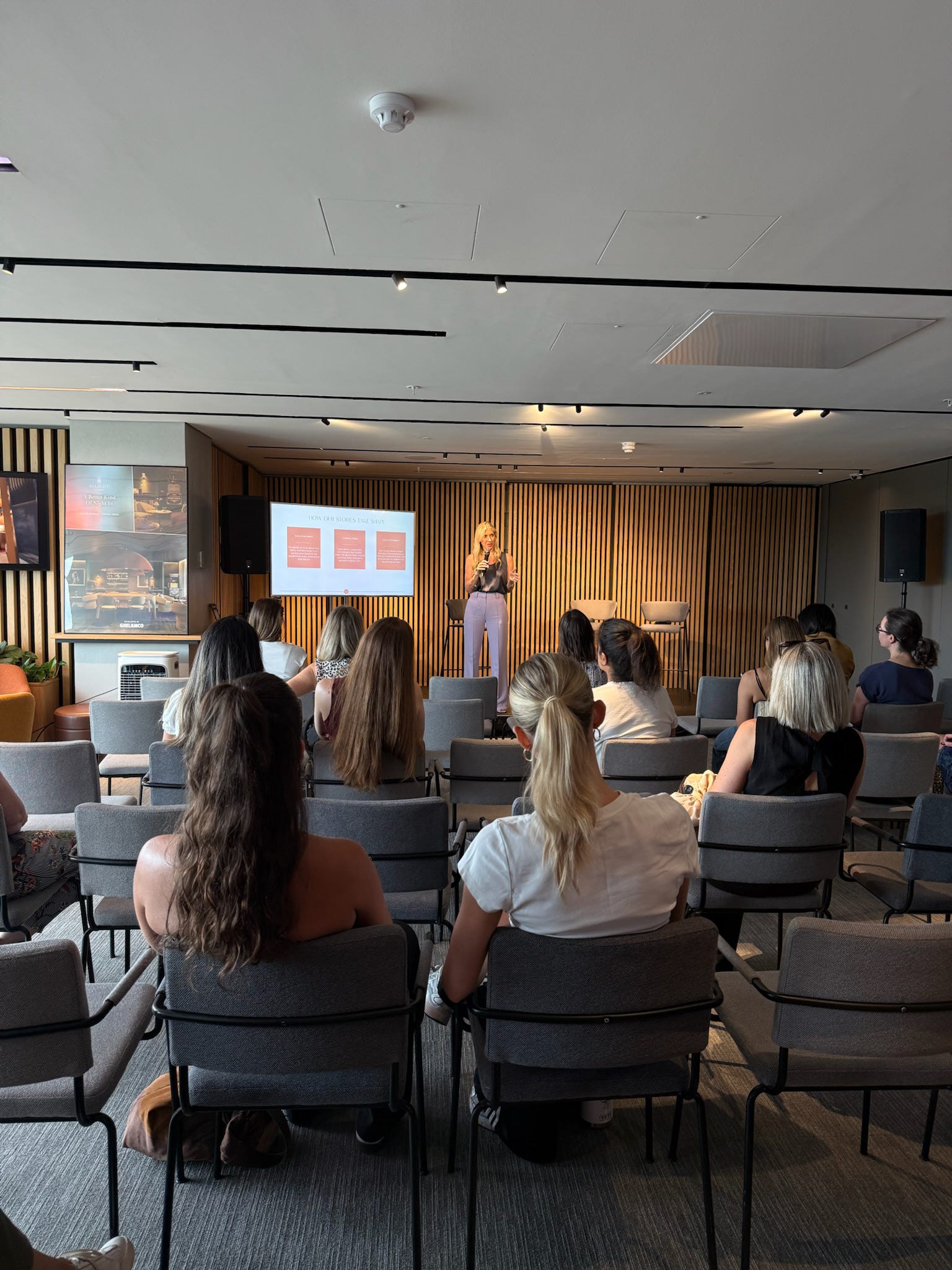 Emmy Brunner speaking to a room