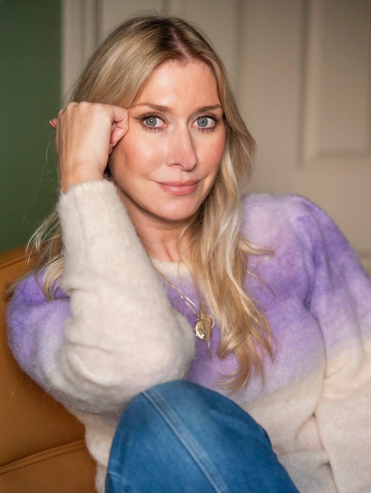 Emmy Brunner on a leather sofa